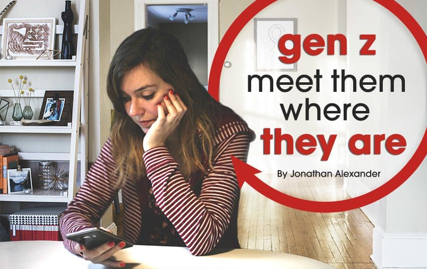 Image of a woman sitting with left hand on her cheek and looking at her phone on her right hand with a text over the image showing gen z meet them where they are By Jonathan Alexander